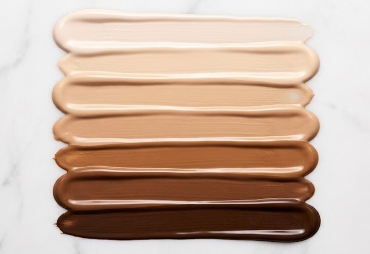 Fitzpatrick skin tone scale showing six fluid foundation shades from fair to deep for dermatology treatment calibration